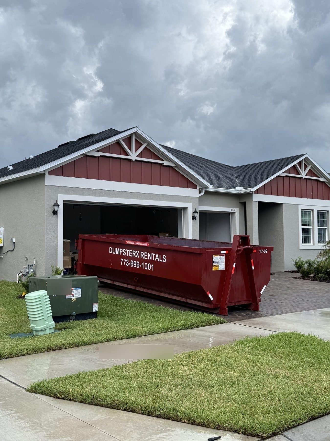 17 yard dumpster rental delivered on a driveway in Pasco County FL