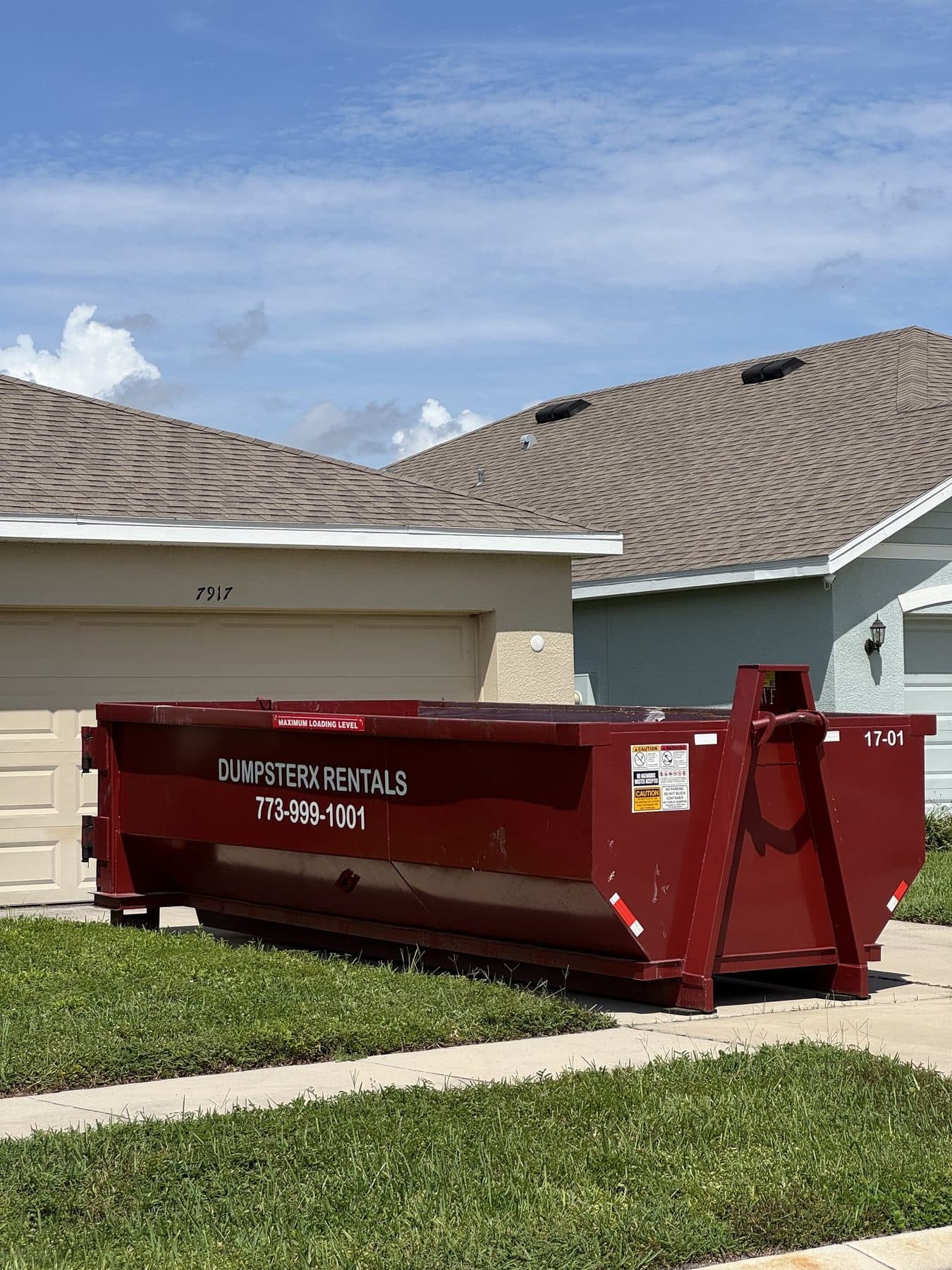 17 yard DumpsterX roll-off dumpster placed at a home
