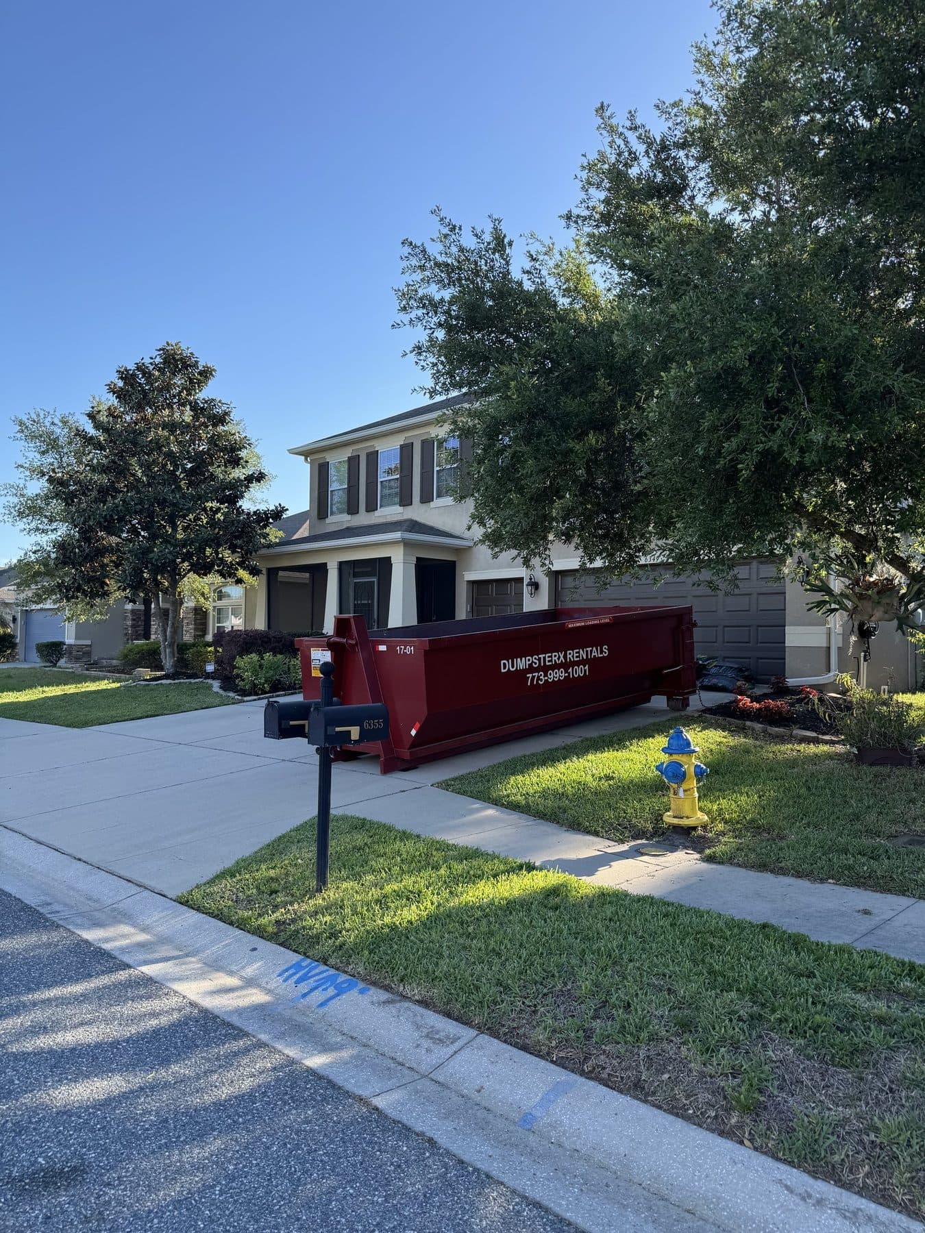 17 yard DumpsterX roll-off dumpster placed at the street