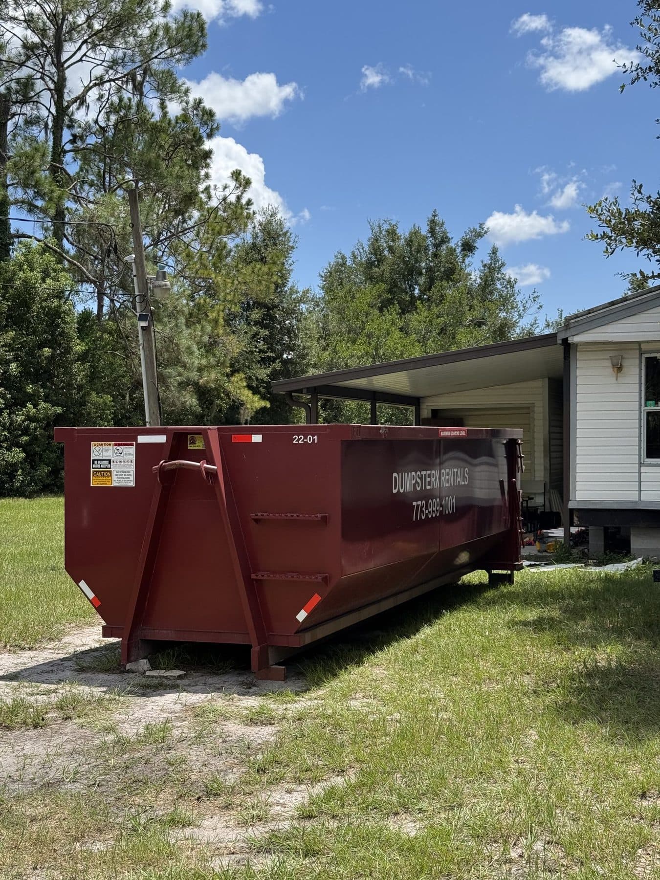 22 yard DumpsterX roll-off dumpster placed at a home