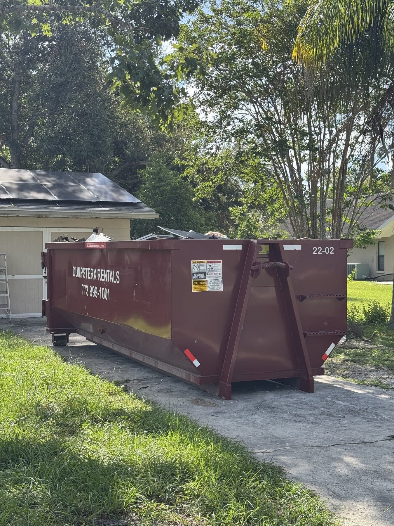 22 yard DumpsterX dumpster placed for a yard and junk clear-out