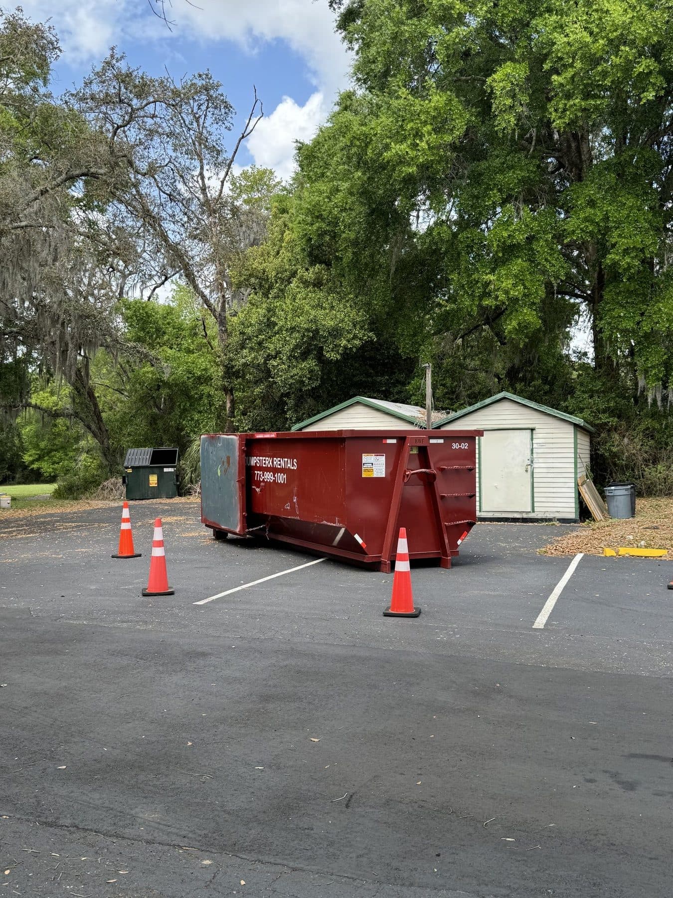 30 yard DumpsterX dumpster on a commercial job site with safety cones