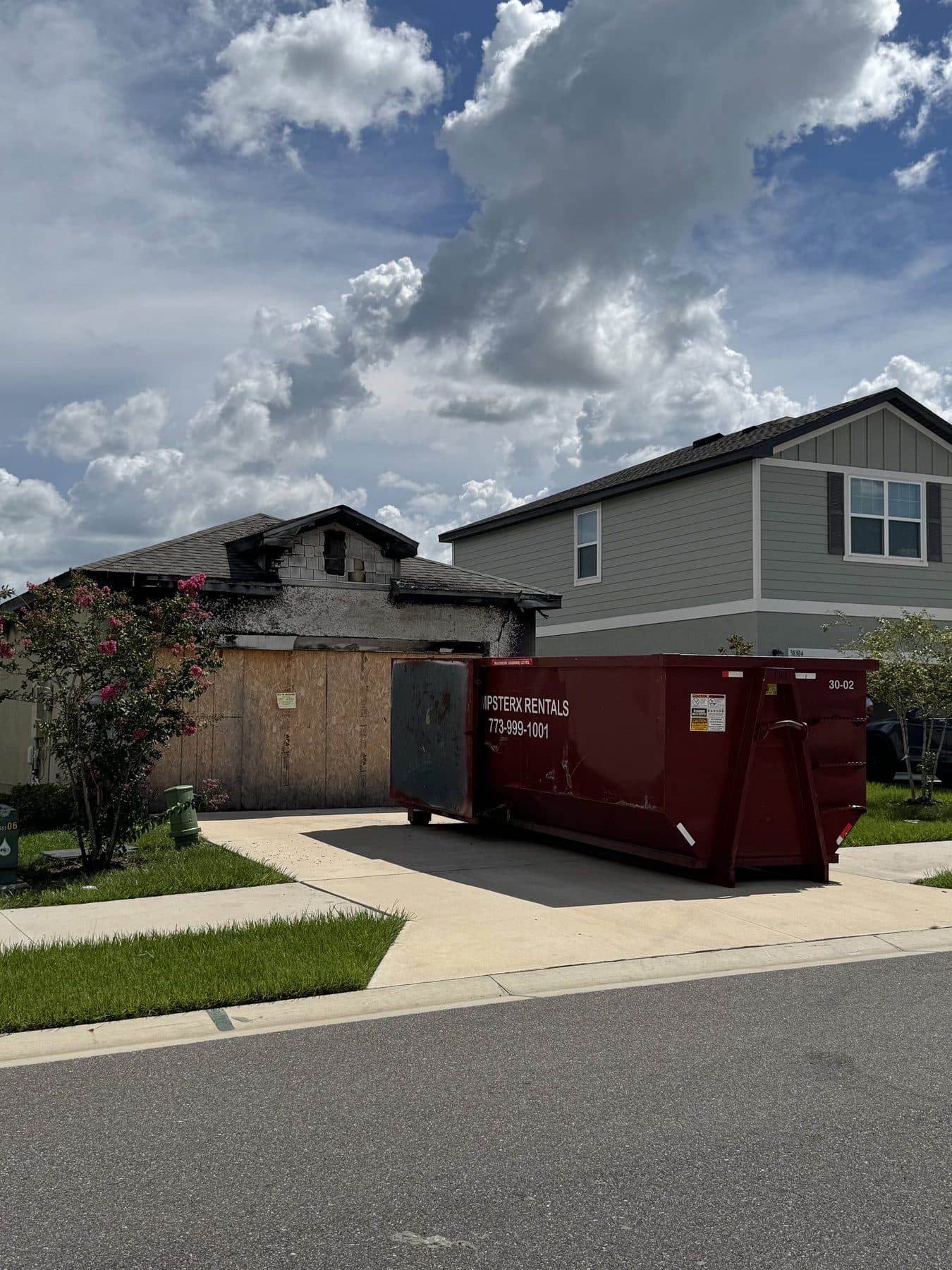 30 yard DumpsterX roll-off dumpster placed at a home