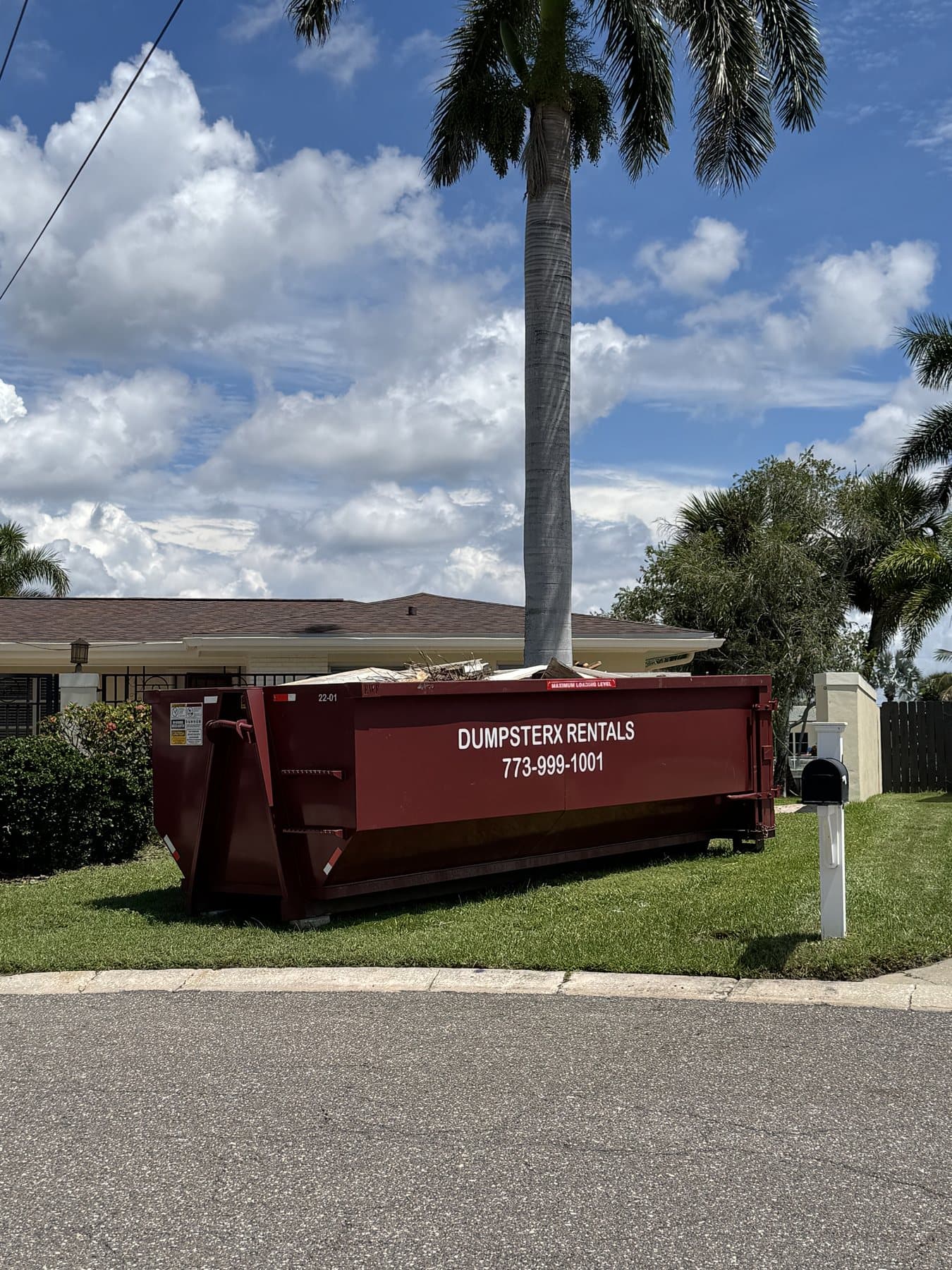 22 yard DumpsterX roll-off dumpster loaded on a job